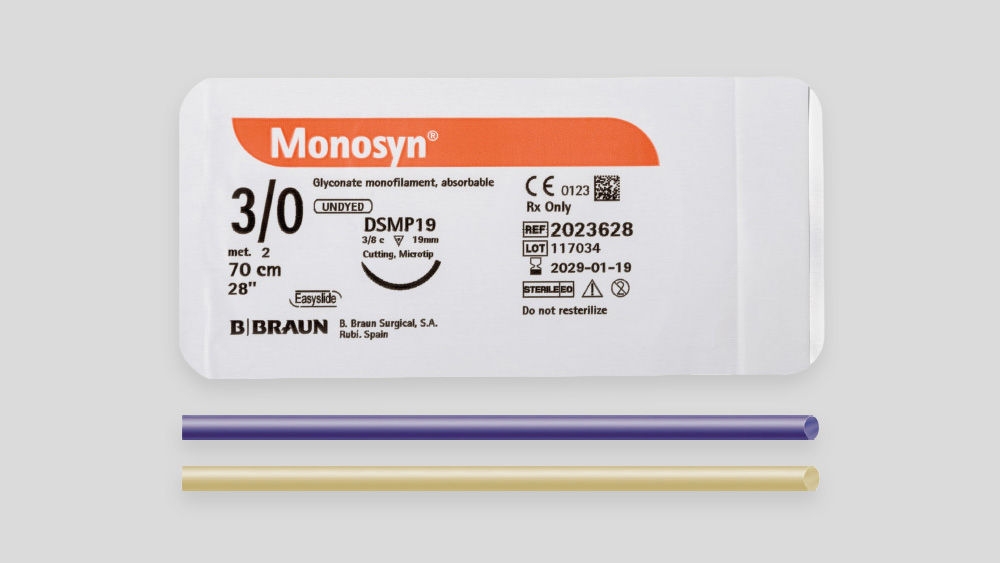 Monosyn® absorbable suture packaging with product label displaying thread size (USP 3/0), needle information, length, CE marking, and B. Braun branding, shown together with the suture thread below the package.
