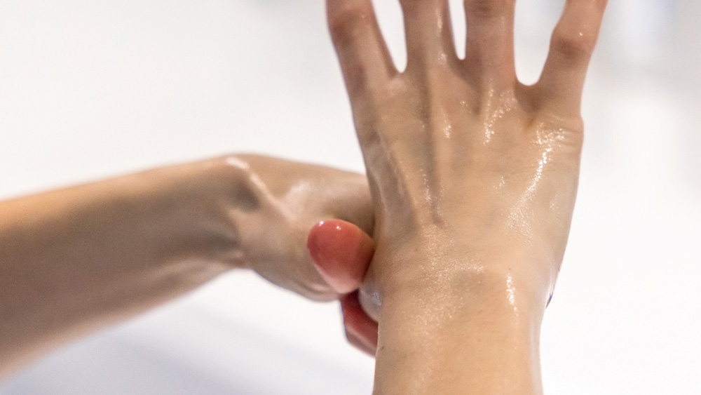 Hands being thoroughly washed and disinfected with soap or antiseptic solution.