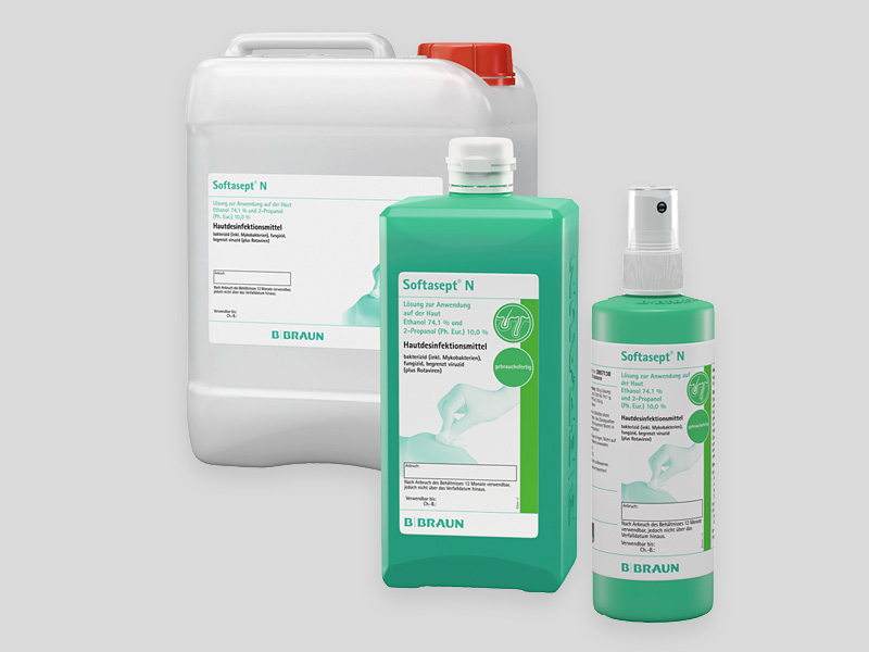 Three B. Braun Softasept® N hand disinfectant containers in different sizes, including a large white canister, a medium green bottle, and a small green spray bottle, displayed on a light gray background.